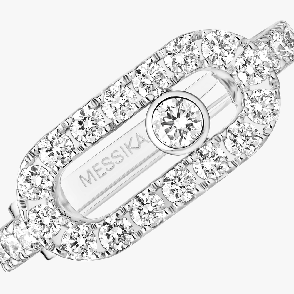Clip d'oreille Move Uno pavé Clip d'oreille Move Uno en or blanc 18 carats, serti de diamants taille brillant et d'un diamant mobile.
