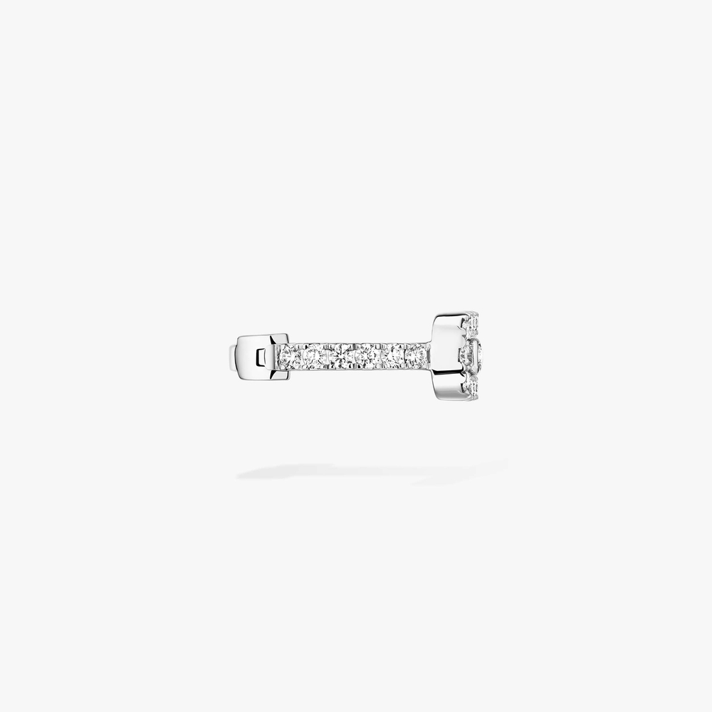 Clip d'oreille Move Uno pavé Clip d'oreille Move Uno en or blanc 18 carats, serti de diamants taille brillant et d'un diamant mobile.