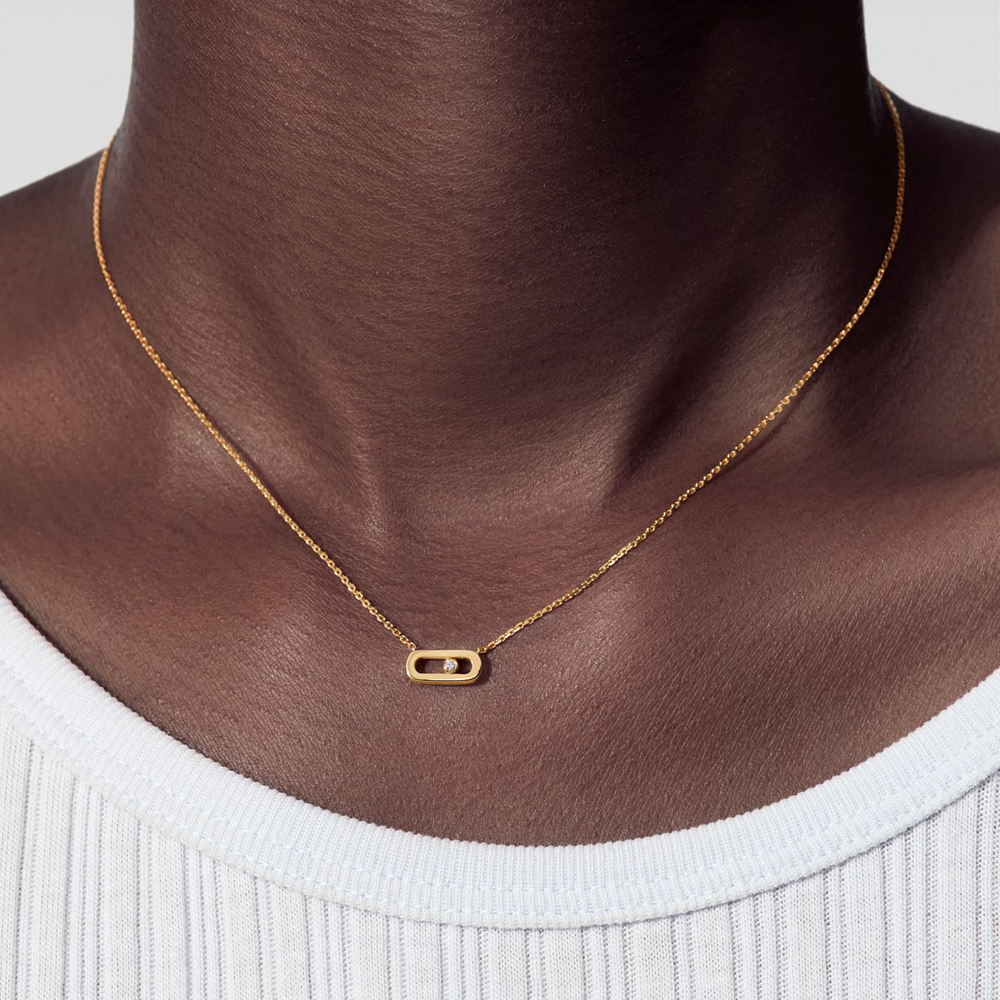 Collier Move Uno, mini modèle Collier Move Uno en or jaune 18 carats, motif serti d'un diamant mobile taille brillant en son centre.